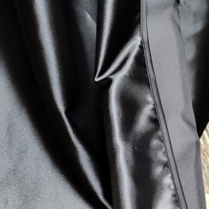 black cloak satin fabric detail